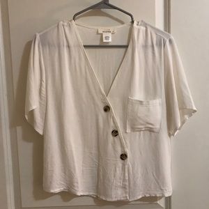 White blouse with tortoise buttons
